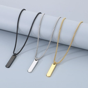 Detailed view of rectangular steel bar pendants in black, silver, and gold finishes