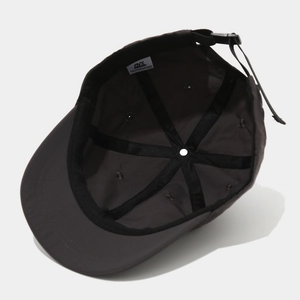 Detail view of dark grey quick-dry baseball cap interior with reinforced seams