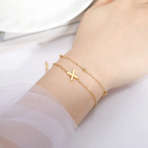 Double-layered gold stainless steel bracelet with cross pendant and metal beads for women