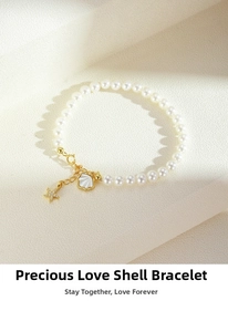Detail view of pearl bracelet with starfish and shell pendants on textured background