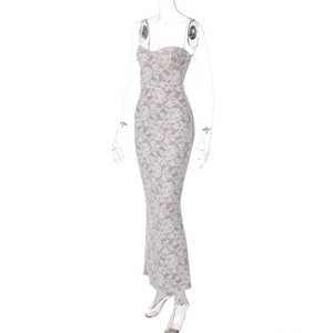 Detail of elegant white floral lace overlay and slim fit design on a long maxi dress