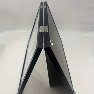 Detail of black wood grain double-fold display frame with silver metal hinges and hooks