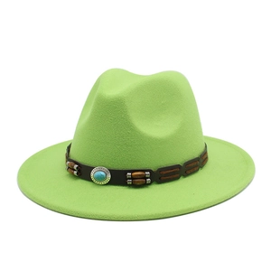 Detail of lime green felt fedora hat with turquoise bead and wooden bead trim band