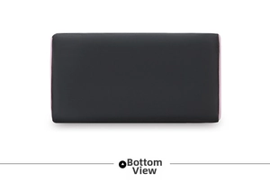 Detail view of the black nylon pillow bag bottom with pink piping and flat rectangular base