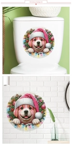 Detail of Christmas puppy sticker with wreath on bathroom wall and toilet tank