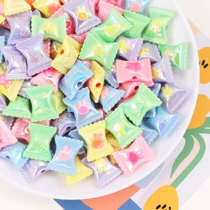 Mixed pastel acrylic candy beads with rabbit relief in a white bowl for DIY jewelry