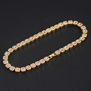 Iced out gold Cuban link necklace with pink square crystals and sparkling rhinestones