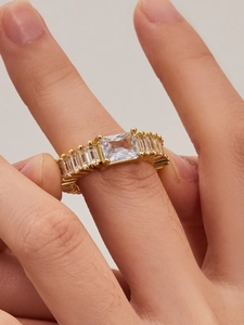 Close-up of 18k gold plated ring with large rectangular zircon and side baguettes