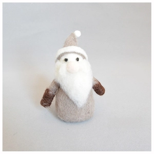 Detail of a handmade wool felt Christmas gnome with grey hat and white beard decoration