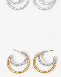 Close-up of stylish double C-shaped hoop earrings in silver and gold-silver combinations