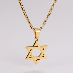 Close-up of a polished gold hollow hexagonal star pendant necklace in stainless steel