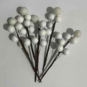 Detailed view of artificial white berry stems with glitter finish for wedding gift boxes
