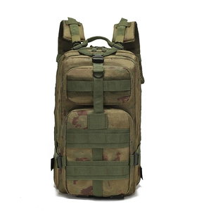 Detail view of woodland camouflage tactical backpack with MOLLE system and nylon straps