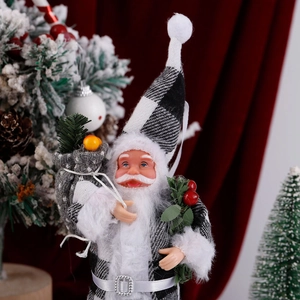 Detail of Santa Claus plush in black and white plaid suit with a festive red background