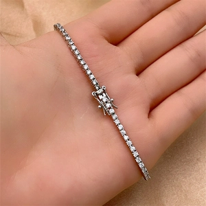 Macro view of silver tennis bracelet featuring sparkling round-cut cubic zirconia stones