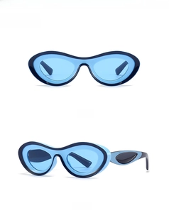 Front and 45-degree side views of modern blue Y2K sunglasses with wavy frames