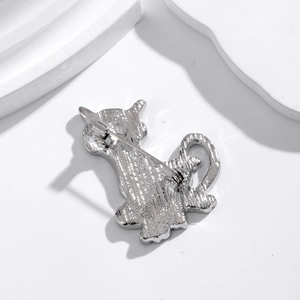 Rear view of silver metal cat brooch showing the pin mechanism and high-quality texture