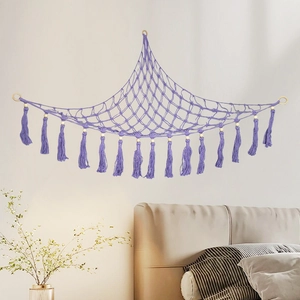 Purple macrame toy hammock with wooden rings and tassels for plush toy storage and wall decor