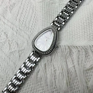 Elegant silver snake-style watch for women with water-drop dial on white knit background