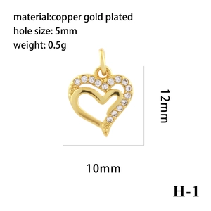 Macro detail of 18K gold plated heart pendant with zircon inlay and product measurements