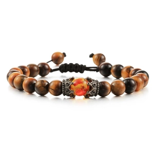 Tiger eye bead bracelet with crown charm and adjustable black cord on white background