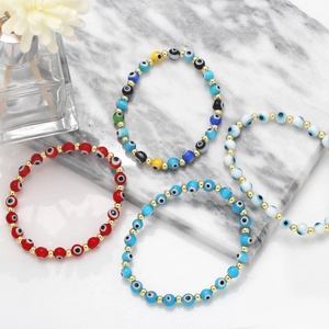 Detailed shot of Evil Eye beaded bracelets with colorful Turkish beads and golden spacers