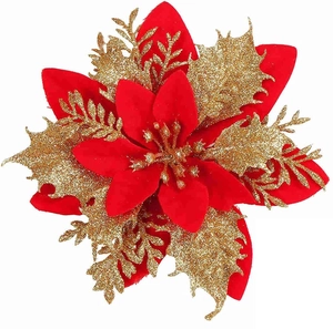 Macro detail of red velvet poinsettia petals with gold glitter branches for Christmas