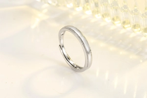 Macro shot of silver S925 ring featuring delicate milgrain edges and high-polish finish