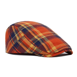 Detailed view of the plaid flat cap showing premium woven cotton fabric and retro patterns
