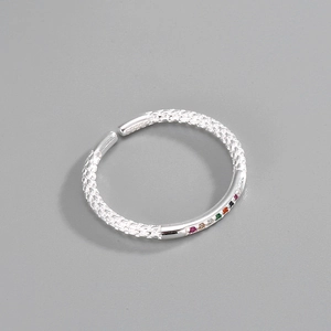 Close-up of S925 sterling silver ring with colorful rainbow zircons and mesh texture
