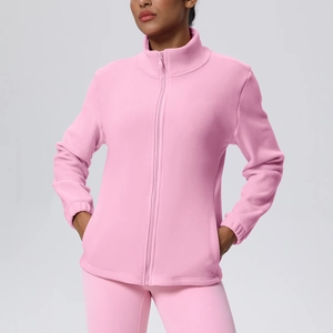 Detailed view of pink fleece zip-up sports jacket with high collar and side pockets