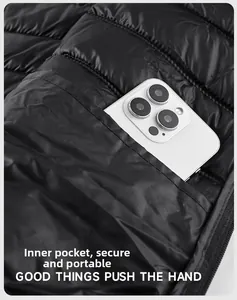 Detail view of the inner secure pocket in black vest, fitting a large smartphone