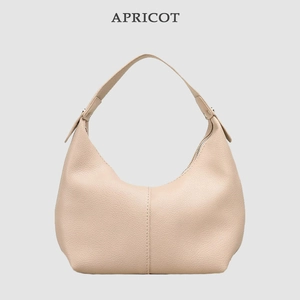 Detailed view of the stylish apricot litchi pattern leather underarm shoulder dumpling bag.