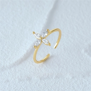Macro detail of S925 sterling silver stamp on gold-plated ring with zircon stones