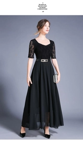Detail of elegant black maxi dress with lace bodice, heart neckline and buckled belt