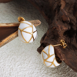 Elegant geometric titanium steel earrings with white enamel and gold textured lines