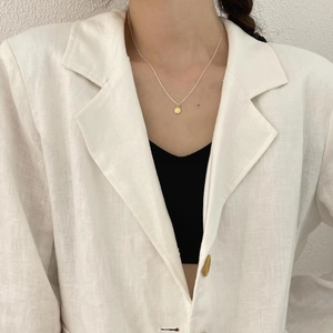 Minimalist 925 sterling silver coin pendant necklace in gold finish worn by model