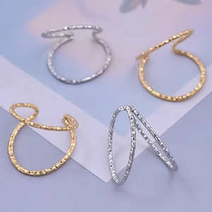 Detail of 304 stainless steel rings with hammered texture in gold and silver finish