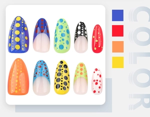 Detail of almond-shaped nails featuring French colorful polka dots on white card