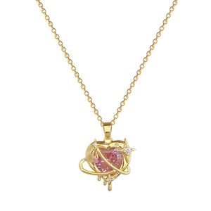 Pink heart crystal necklace with gold planetary ring and star charm in stainless steel