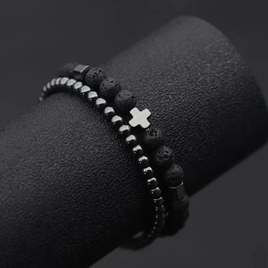 2-piece men's bracelet set with black lava stone, hematite beads, and a cross pendant
