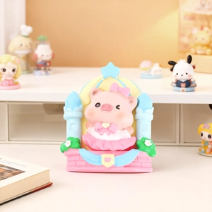 Close-up of pink cartoon pig figurine seated inside a colorful resin castle frame