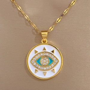 Gold evil eye pendant necklace with blue zircon inlay on white enamel for women