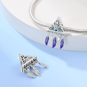 Detail of dreamcatcher pendant with multicolor zircons and feathers on snake chain