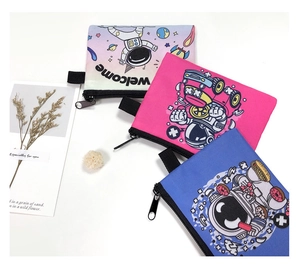 Three astronaut themed cartoon coin purses in pink and blue with zip closure and hooks