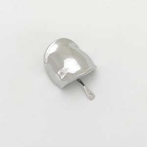 Macro view of a silver alloy U-shaped ponytail hook hair accessory with a polished finish