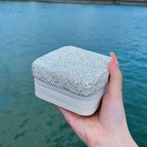Portable double-layer white jewelry box with rhinestone cover and zipper closure