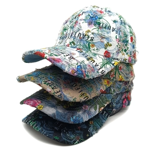 Ethnic style floral distressed baseball caps in four colors with frayed brim details