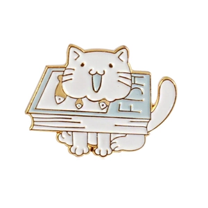 Cartoon white cat on blue FISH book enamel pin with gold plating on white background