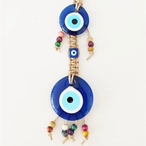 Handmade evil eye wall hanging with blue glass charms, hemp rope, and colorful wooden beads